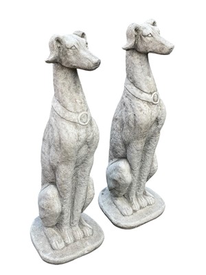 Lot 383 - A pair of reconstituted stone sculptures of seated greyhounds