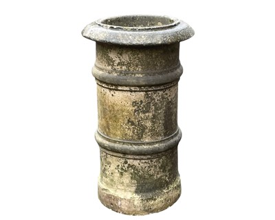 Lot 380 - A buff-coloured rib banded chimney pot of cylindrical form.