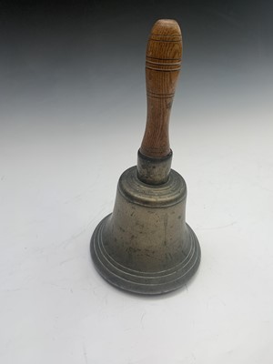 Lot 243 - A late Victorian brass hand bell with turned...