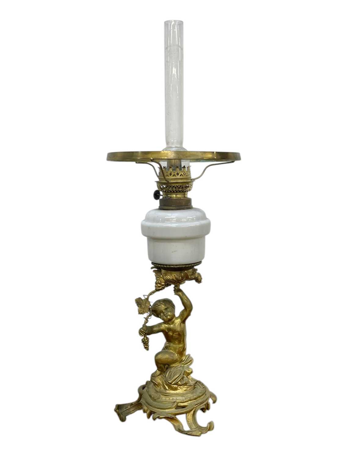 Lot 61 - A 19th century gilt brass cherub oil lamp.