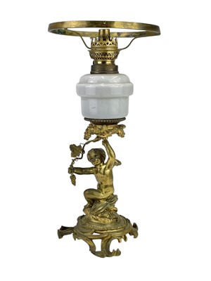 Lot 61 - A 19th century gilt brass cherub oil lamp.