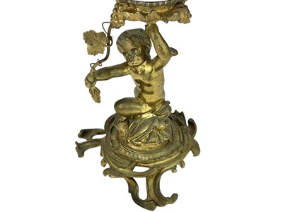 Lot 61 - A 19th century gilt brass cherub oil lamp.