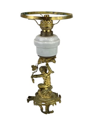 Lot 61 - A 19th century gilt brass cherub oil lamp.