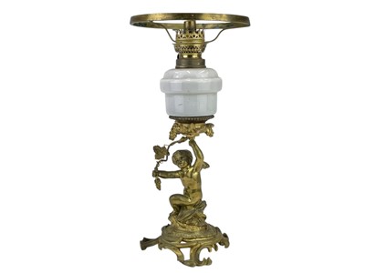 Lot 61 - A 19th century gilt brass cherub oil lamp.