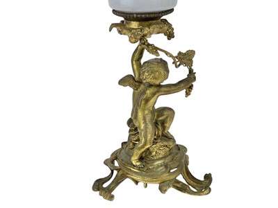 Lot 61 - A 19th century gilt brass cherub oil lamp.
