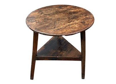 Lot 340 - An 18th century elm circular cricket table.