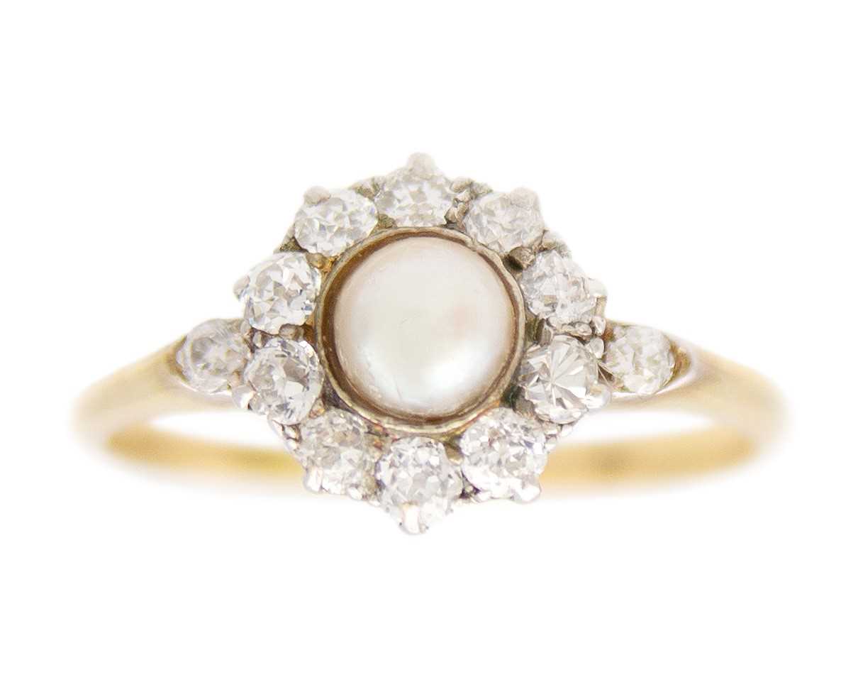 Lot 17 - A high purity gold pearl and diamond cluster ring.