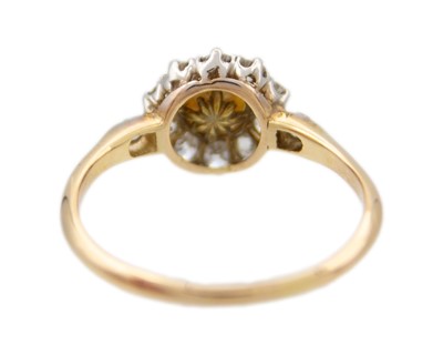 Lot 17 - A high purity gold pearl and diamond cluster ring.