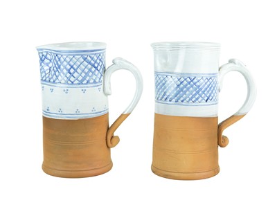 Lot 204 - A pair of blue and white ceramic and terracotta jugs