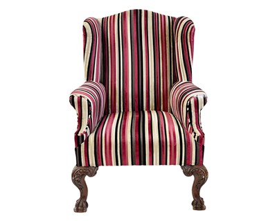 Lot 404 - A wing back upholstered armchair.