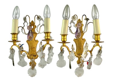 Lot 326 - A pair of gilt metal twin branch wallights.