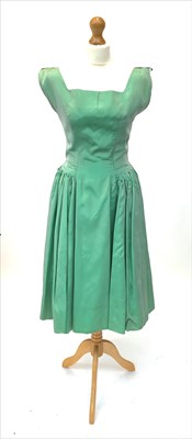 Lot 3026 - A peppermint green satin dress, circa 1950s,...
