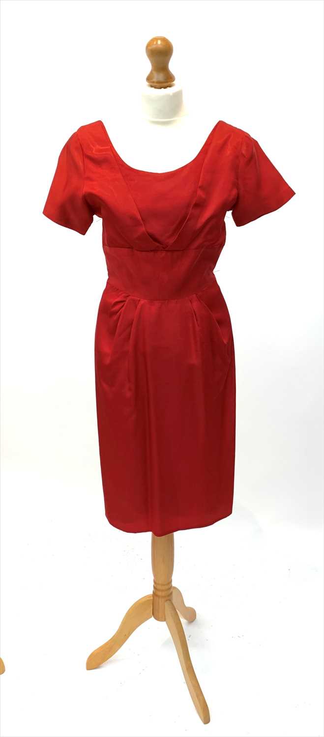 Lot 3029 - A circa 1950s short sleeved red satin knee...