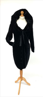 Lot 3031 - A 1980s black velvet long sleeved knee length...
