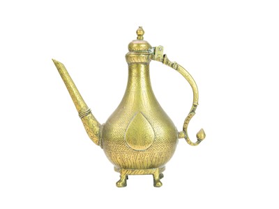 Lot 568 - A Mughal brass water ewer.