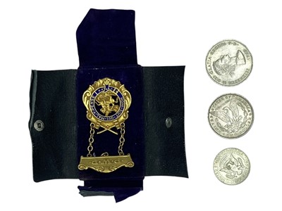 Lot 118 - A Masonic P.W.P. gold-plated jewel, a USA 1889 Morgan silver dollar and two other coins.