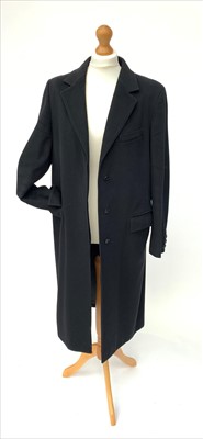 Lot 3040 - A long single breasted black wool coat by Max...