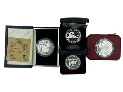 Lot 142 - A selection of four silver proof coins with original boxes and certificates..