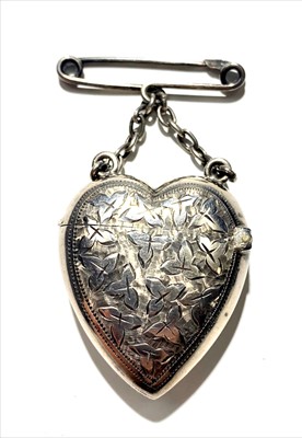Lot 2426 - A silver heart shaped vesta case hanging from...