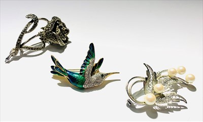 Lot 2429 - Three costume brooches, one singed Holly