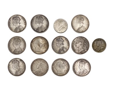 Lot 119 - BRITISH COLONIAL - A collection of Victoria to George V One Rupee silver coins.