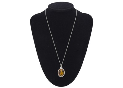 Lot 31 - A selection of four silver pendant necklaces.