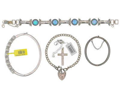 Lot 107 - A silver moonstone bangle with three other bracelets.