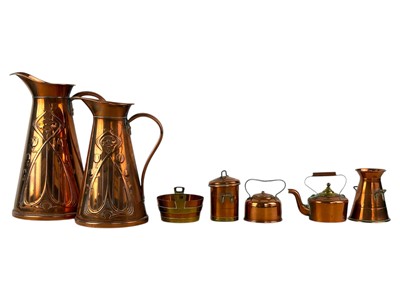 Lot 80 - Two Joseph Sankey and Sons graduated copper jugs.