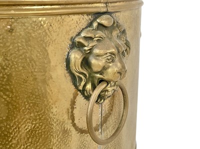 Lot 66 - A brass jardiniere on stand, circa 1900.