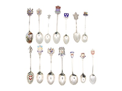 Lot 46 - A collection of 12 British & continental silver and enamel souvenir teaspoons, and two others in silver.