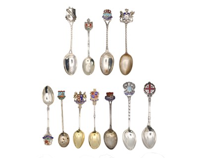Lot 49 - A collection of ten silver and enamel teaspoons.