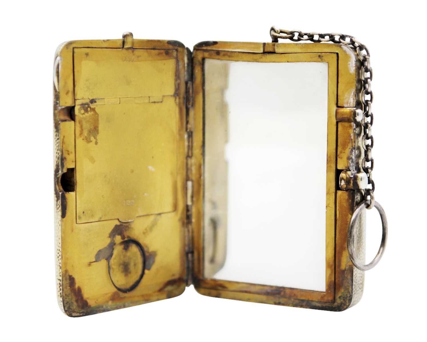 Lot 211 - An Edwardian silver gilt combination compact purse by Cohen & Charles.