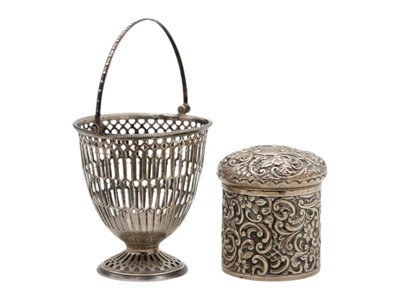 Lot 69 - A George V silver swing-handled pedestal bon bon basket and a Victorian silver embossed lidded pot.