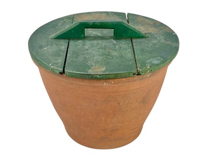 Lot 114 - A terracotta bread crock.