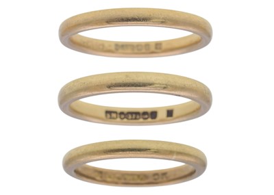 Lot 112 - A selection of three 9k yellow gold band rings.