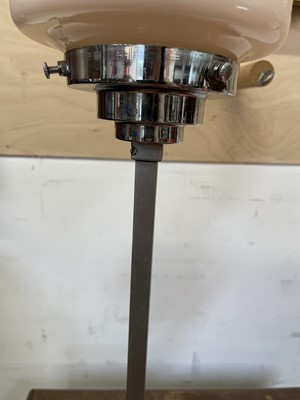 Lot 477 - An Art Deco chrome and pink glass table lamp.