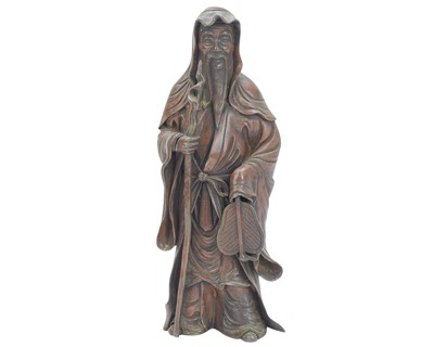 Lot 641 - A Japanese bronzed metal figure of a sage.