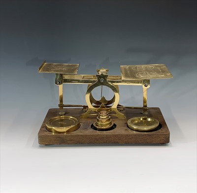 Lot 147 - A set of large brass and oak parcel scales,...