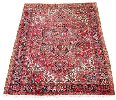Lot 674 - A Heriz carpet.