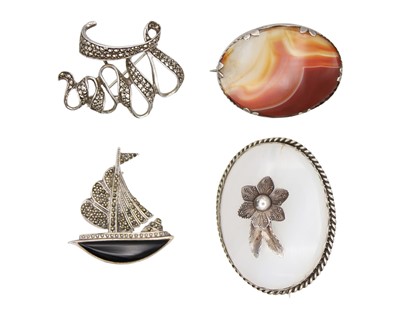 Lot 43 - A selection of silver stone set brooches.