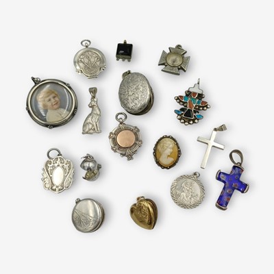 Lot 175 - A selection of silver, gilt, and gold-plated pendants and lockets.