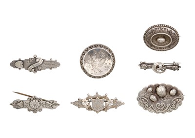 Lot 63 - A selection of six Victorian silver brooches.
