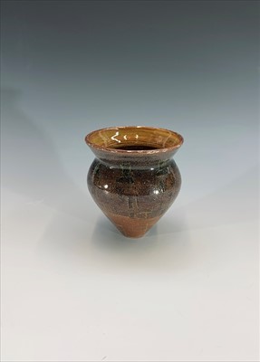 Lot 1035 - A studio pottery vase of conical form, incised...