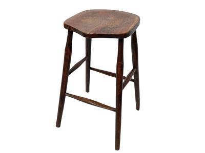 Lot 887 - An elm and beech 'saddle' top stool.