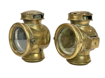 Lot 149 - A pair of Victorian brass and glass coach lamps.