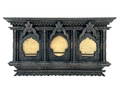 Lot 84 - An ornate Eastern hardwood triple frame.