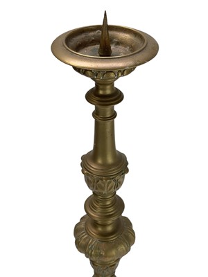 Lot 24 - Two similar brass pricket altar candlesticks.