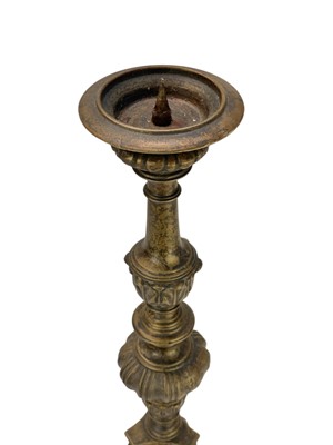 Lot 24 - Two similar brass pricket altar candlesticks.
