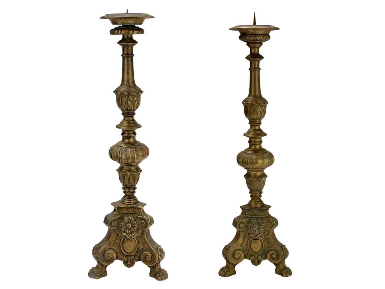 Lot 24 - Two similar brass pricket altar candlesticks.