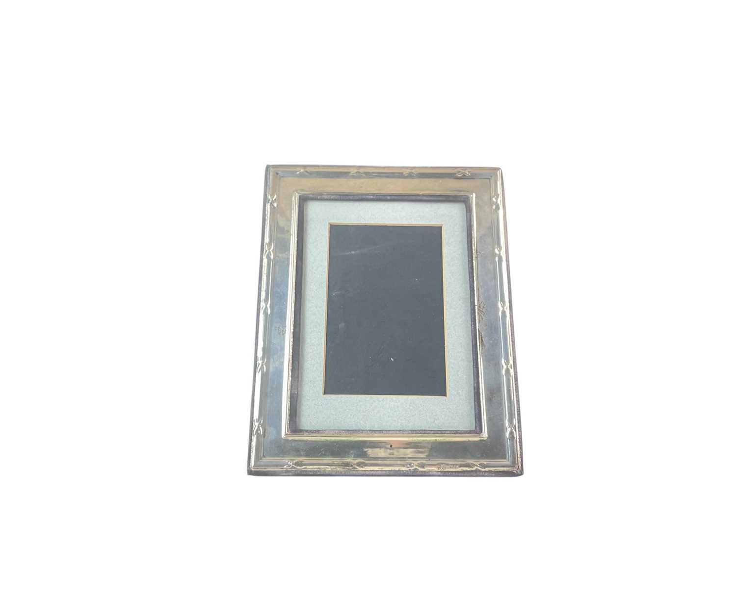 Lot 252 - A silver rectangular easel photograph frame, of Neoclassical design.